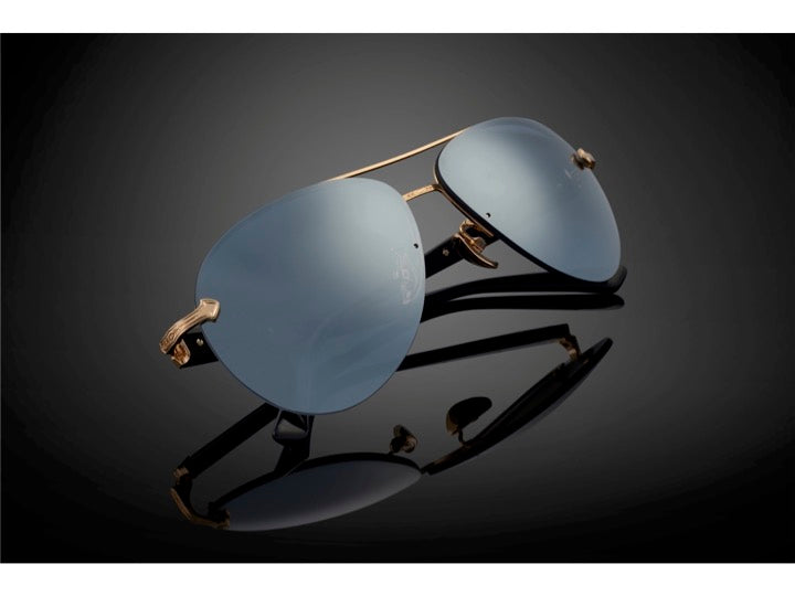 DOMINANCE sunglasses in Mirror [Black] – flat lay on dark background with soft spotlight