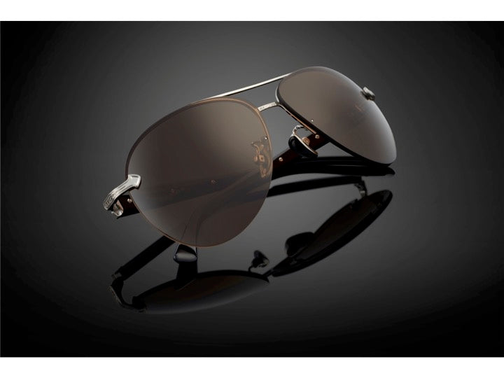 DOMINANCE sunglasses in Mirror [Brown] – flat lay shot with strong contrast
