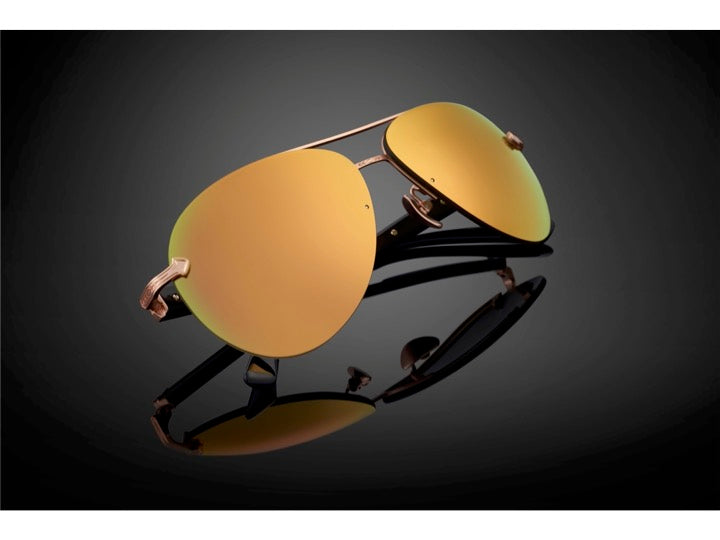 DOMINANCE sunglasses in Mirror [Gold] – golden lens glow on dark gradient background